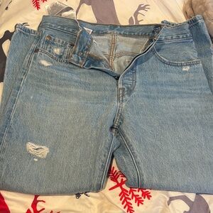 Woman’s light wash distressed jean